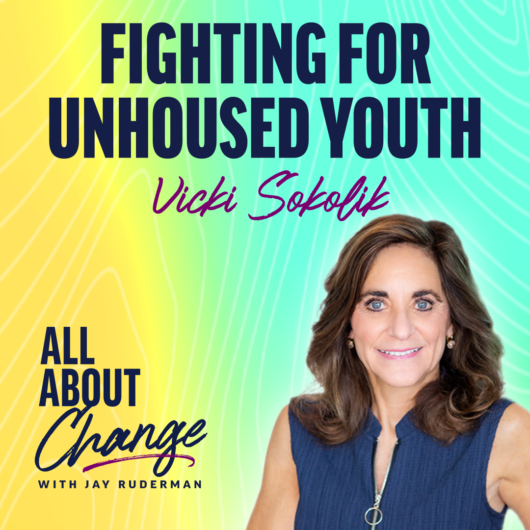 Vicki Sokolik stands in front of a colorful background with text that reads “Fighting For Unhoused Youth” and the "All About Change" podcast.